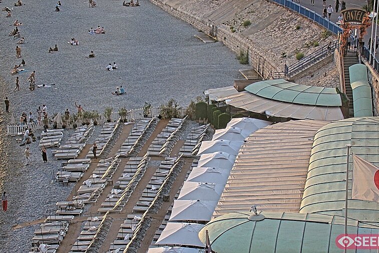 Webcam view of the Castel beach and club on the eastern-most side of the Promenade des Anglais and nestled under the Parc du Chateau, in Nice, France
