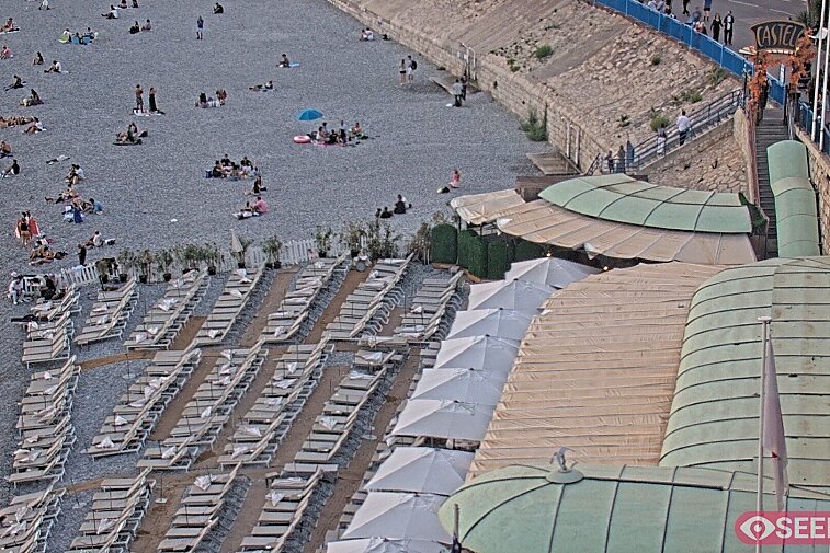 Webcam view of the Castel beach and club on the eastern-most side of the Promenade des Anglais and nestled under the Parc du Chateau, in Nice, France
