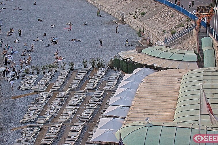 Webcam view of the Castel beach and club on the eastern-most side of the Promenade des Anglais and nestled under the Parc du Chateau, in Nice, France