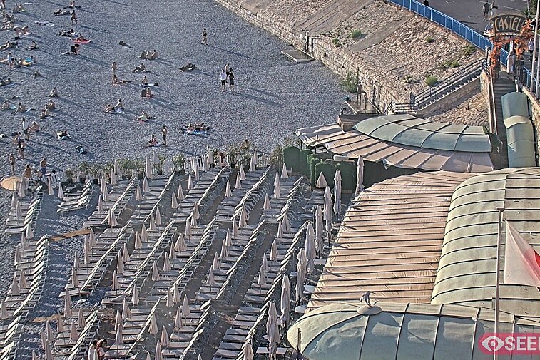 Webcam view of the Castel beach and club on the eastern-most side of the Promenade des Anglais and nestled under the Parc du Chateau, in Nice, France