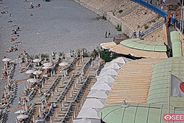 Webcam view of the Castel beach and club on the eastern-most side of the Promenade des Anglais and nestled under the Parc du Chateau, in Nice, France