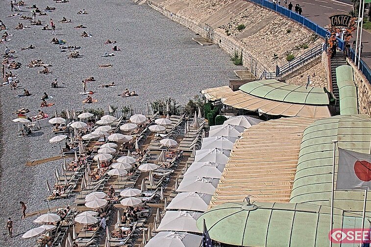 Webcam view of the Castel beach and club on the eastern-most side of the Promenade des Anglais and nestled under the Parc du Chateau, in Nice, France