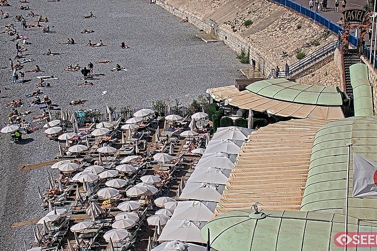 Webcam view of the Castel beach and club on the eastern-most side of the Promenade des Anglais and nestled under the Parc du Chateau, in Nice, France