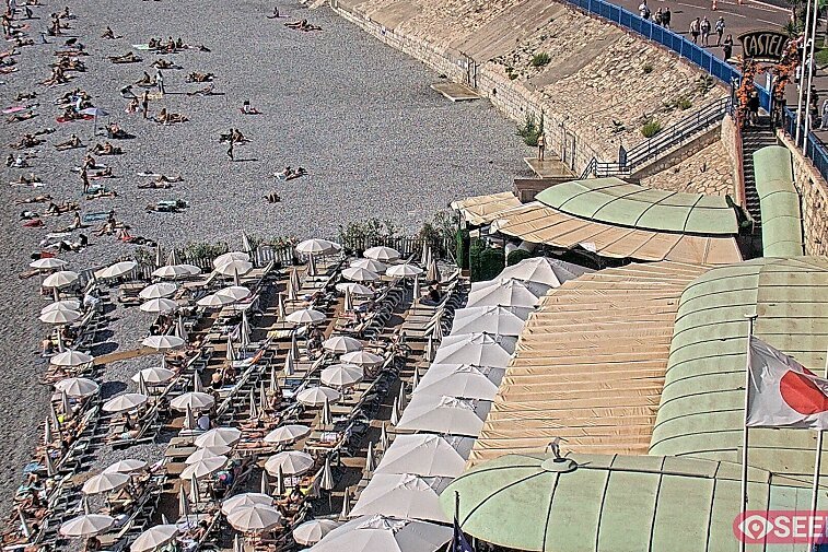 Webcam view of the Castel beach and club on the eastern-most side of the Promenade des Anglais and nestled under the Parc du Chateau, in Nice, France