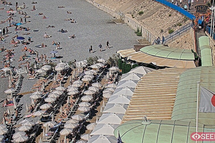 Webcam view of the Castel beach and club on the eastern-most side of the Promenade des Anglais and nestled under the Parc du Chateau, in Nice, France