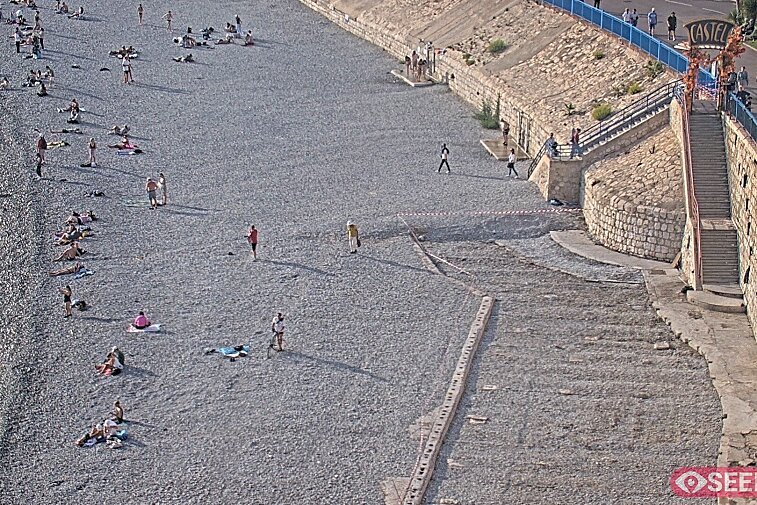 Webcam view of the Castel beach and club on the eastern-most side of the Promenade des Anglais and nestled under the Parc du Chateau, in Nice, France