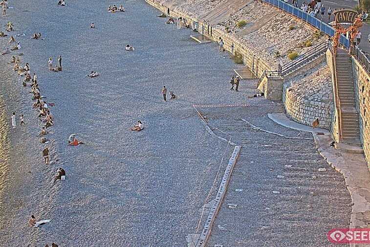 Webcam view of the Castel beach and club on the eastern-most side of the Promenade des Anglais and nestled under the Parc du Chateau, in Nice, France