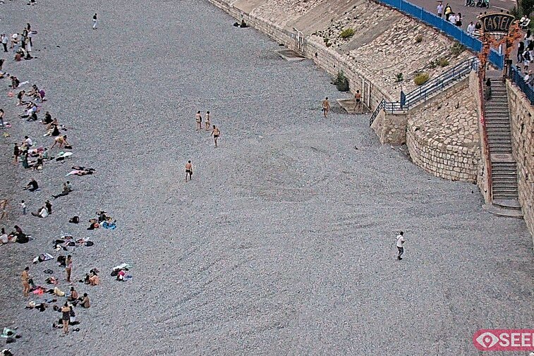 Webcam view of the Castel beach and club on the eastern-most side of the Promenade des Anglais and nestled under the Parc du Chateau, in Nice, France