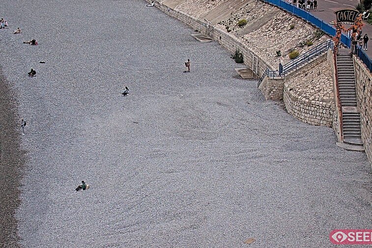 Webcam view of the Castel beach and club on the eastern-most side of the Promenade des Anglais and nestled under the Parc du Chateau, in Nice, France