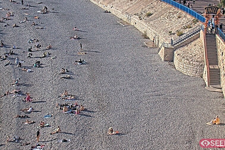 Webcam view of the Castel beach and club on the eastern-most side of the Promenade des Anglais and nestled under the Parc du Chateau, in Nice, France