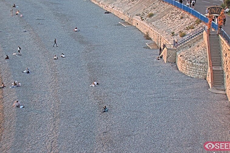 Webcam view of the Castel beach and club on the eastern-most side of the Promenade des Anglais and nestled under the Parc du Chateau, in Nice, France