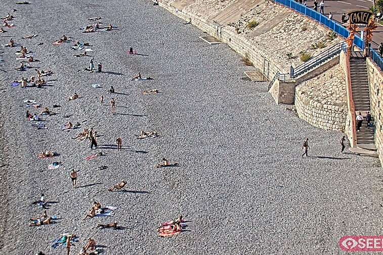 Webcam view of the Castel beach and club on the eastern-most side of the Promenade des Anglais and nestled under the Parc du Chateau, in Nice, France