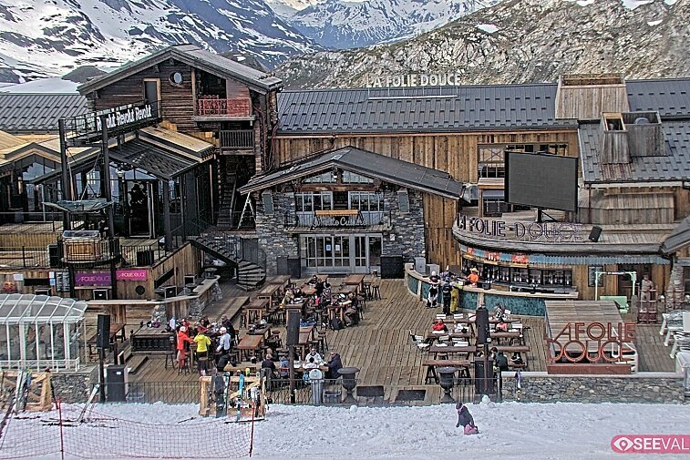 View of La Folie Douce restaurant in the ski area above La Daille in Val d'Isere.  From 2PM when the weather is good, see live musicians and the apres-ski party.