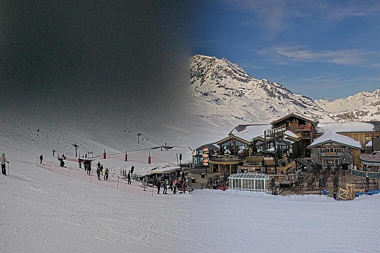 A webcam view of the Val d'Isere ski area above La Daille, near the Tommeuses chairlift.  The building in the centre is the renowned La Folie Douce restaurant.