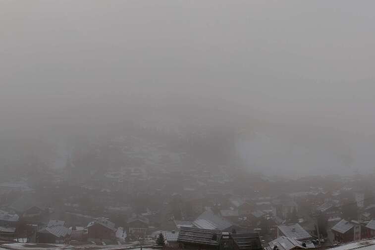This is a delightful view of Les Gets village with ski areas in the background.