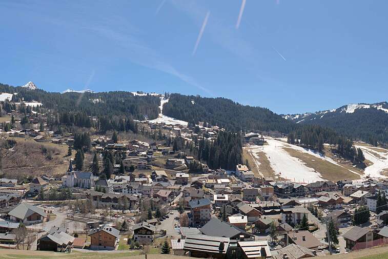 This is a delightful view of Les Gets village with ski areas in the background.