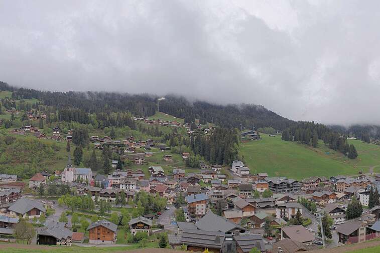 This is a delightful view of Les Gets village with ski areas in the background.
