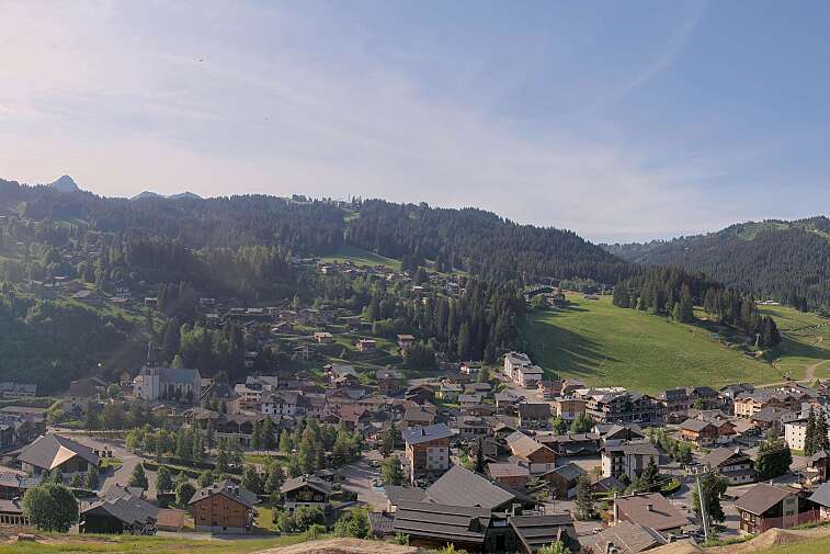 This is a delightful view of Les Gets village with ski areas in the background.