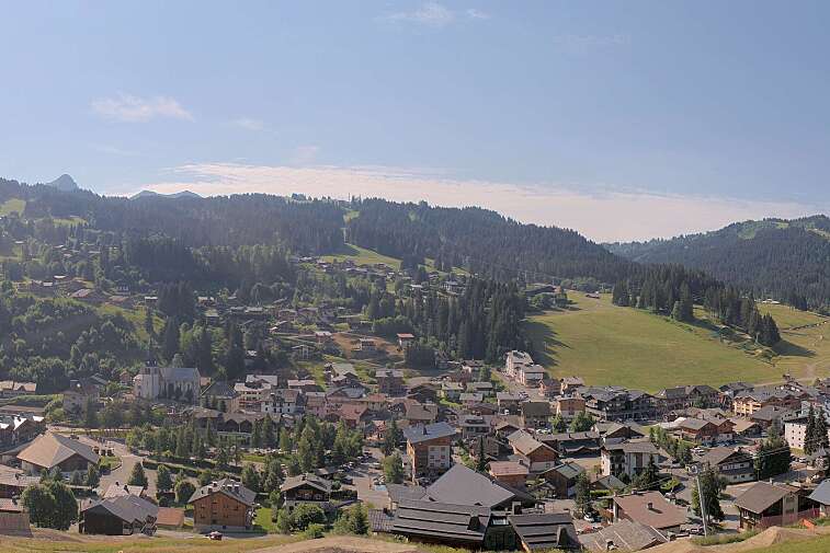This is a delightful view of Les Gets village with ski areas in the background.