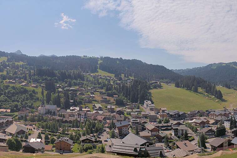 This is a delightful view of Les Gets village with ski areas in the background.