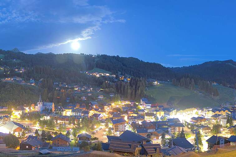 This is a delightful view of Les Gets village with ski areas in the background.