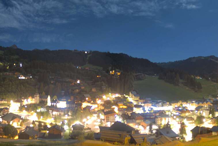 This is a delightful view of Les Gets village with ski areas in the background.